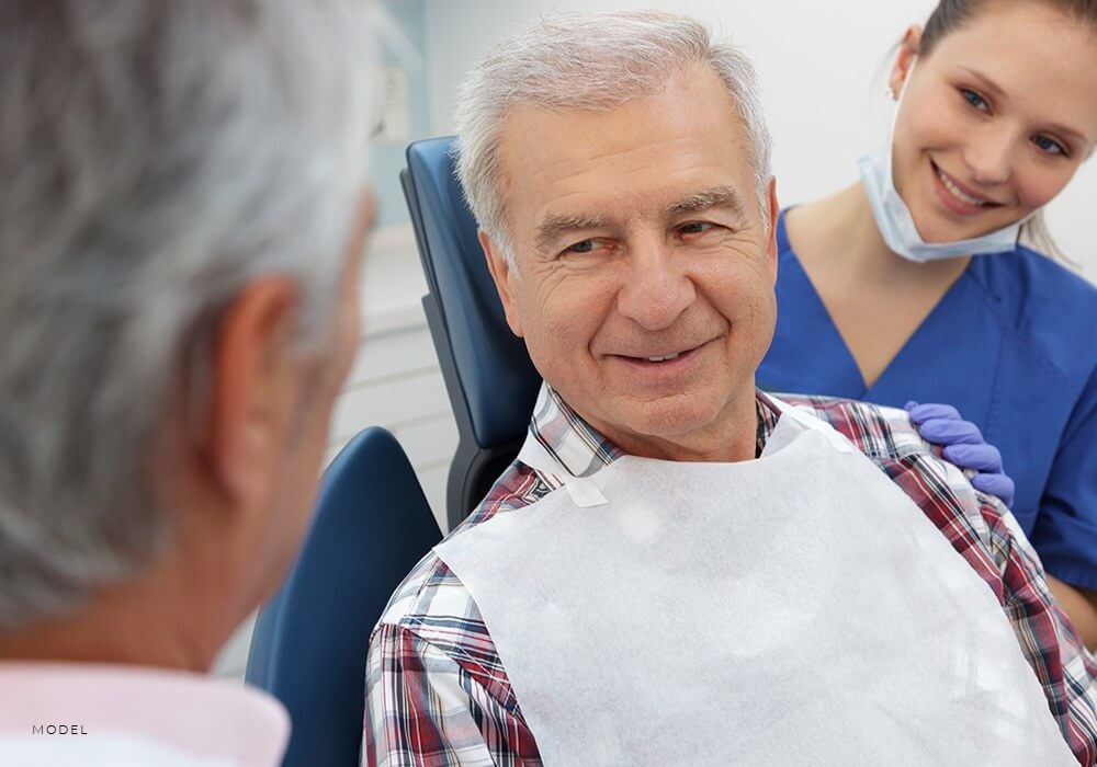 Patient Discussing All-On-4 Dental Implant with Periodontist