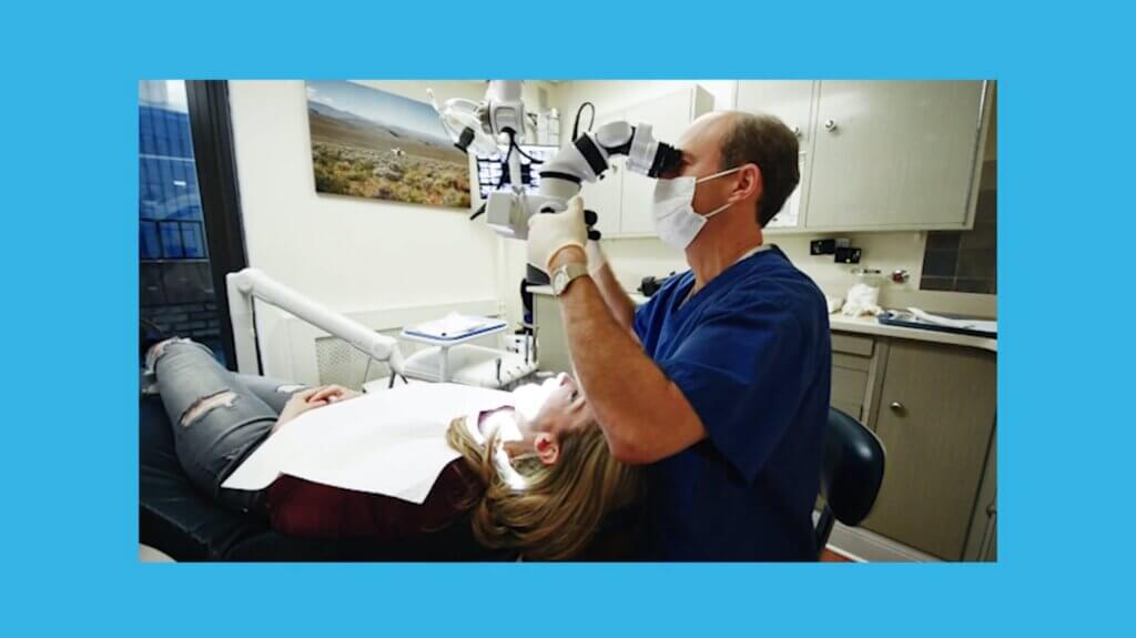 Dr. Kissel performing dental implant surgery using microsurgery