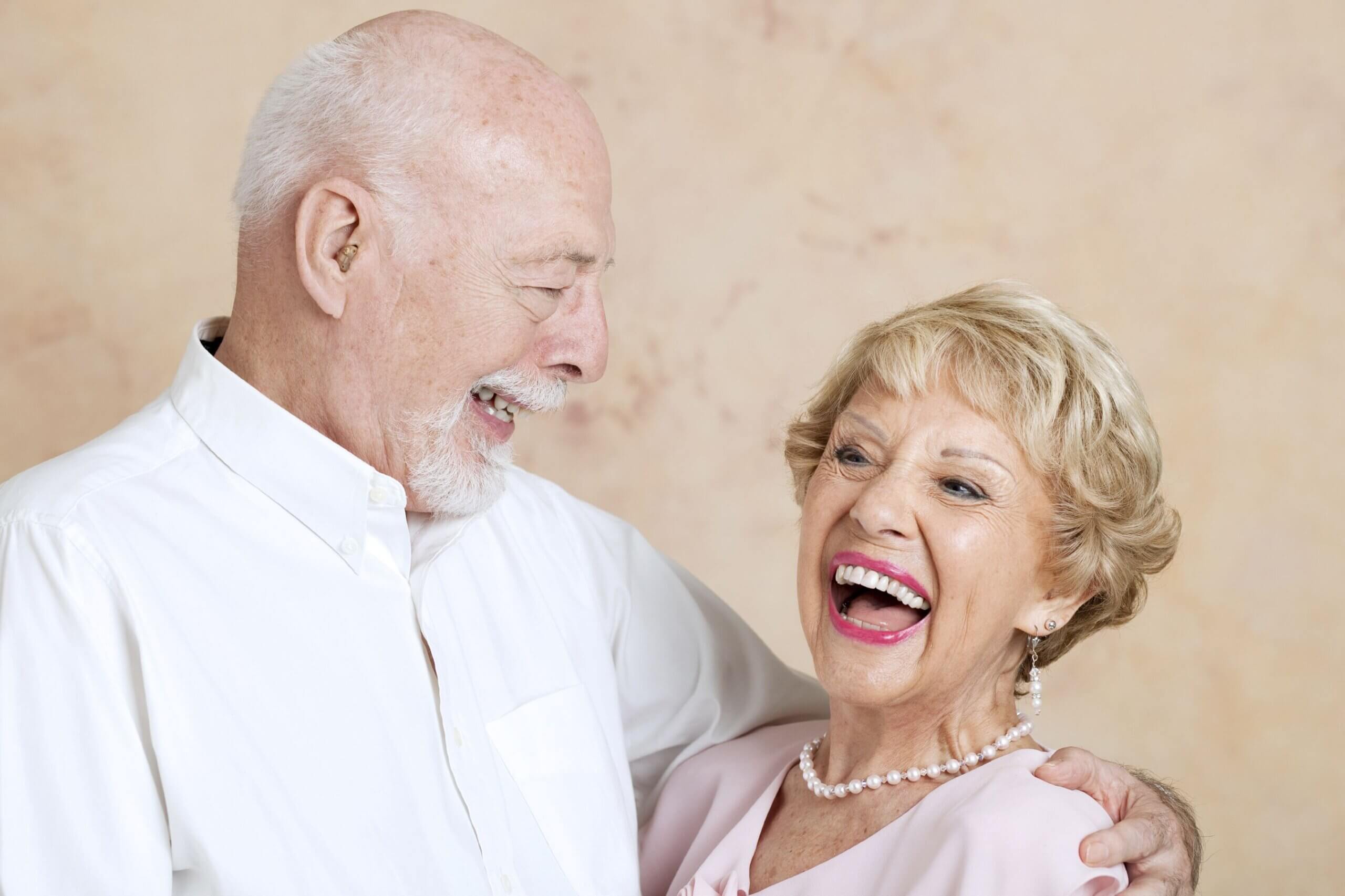 Old Couple Smiling and Laughing In Nice Dress Clothes
